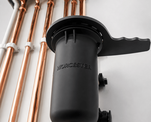Worcester magnetic heating system filter installed beside copper pipework